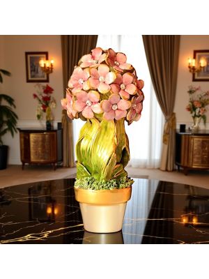 Planta artística de cerámica decorada con pequeñas flores, cristales de Swarovski y detalles dorados, hecha a mano.